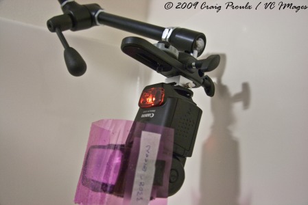 A simple hotshoe mount from an umbrella mount is all you need to mount a speedlight to the magic arm.