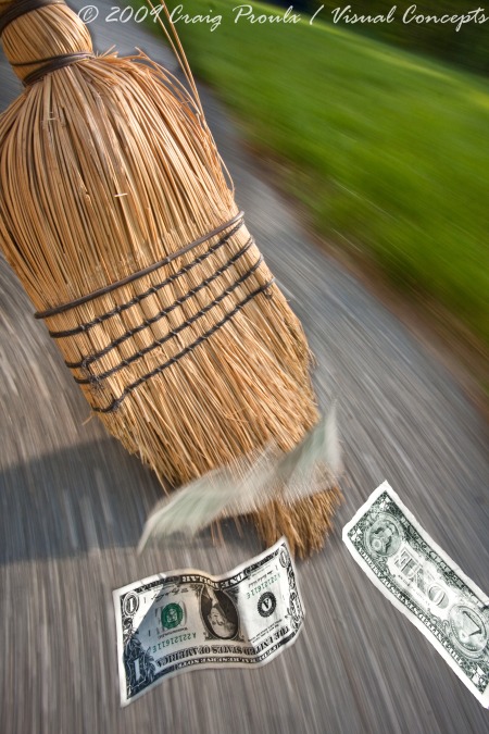 This stock image of a broom sweeping cash, couldn't have been possible to pull off in camera without the magic arm.
